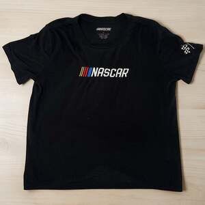 NASCAR Women's Embroidered Logo Black T-Shirt W/ Checker Flag Sleeve Detail Sz L